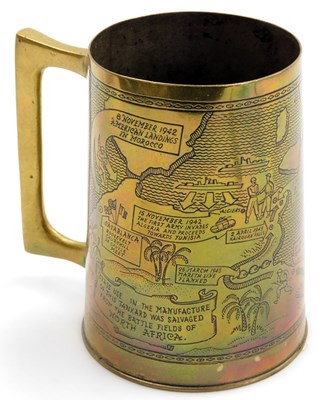 Lot 32 - A WWII brass tankard, from salvage metal from...
