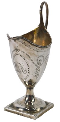Lot 41 - A George III helmet shaped cream jug, with...