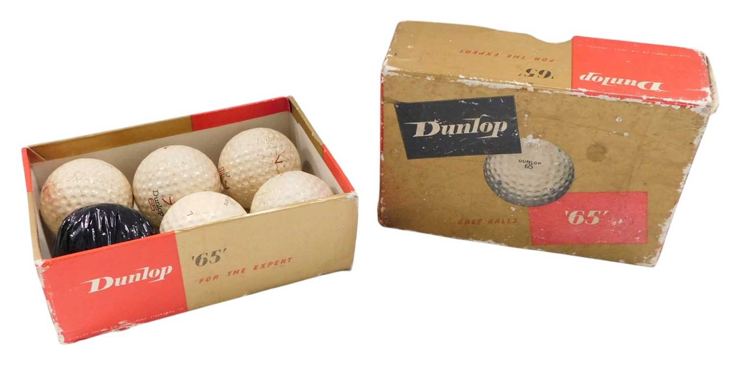Lot 779 - Five Dunlop 65 golf balls, one golf ball in...