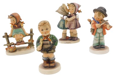 Lot 495 - Four Goebel Hummel figures, to include boy...
