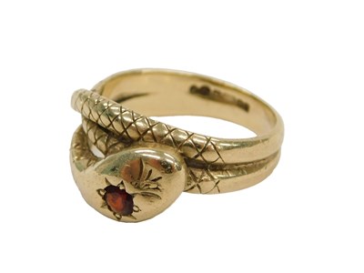 Lot 62 - A 9ct gold and garnet set snake ring, size Q½,...