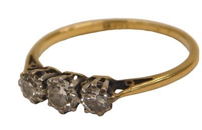 Lot 79 - A diamond three stone ring, claw set, in...