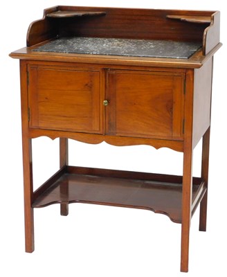 Lot 1102 - A late 19thC mahogany washstand, the top with...