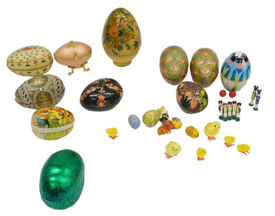Lot 1061 - A group of painted metal and wooden eggs, some...