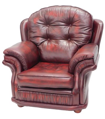 Lot 1131 - A red leather upholstered armchair, with...