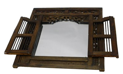 Lot 1196 - An unusual Eastern wall mirror, with a pierced...