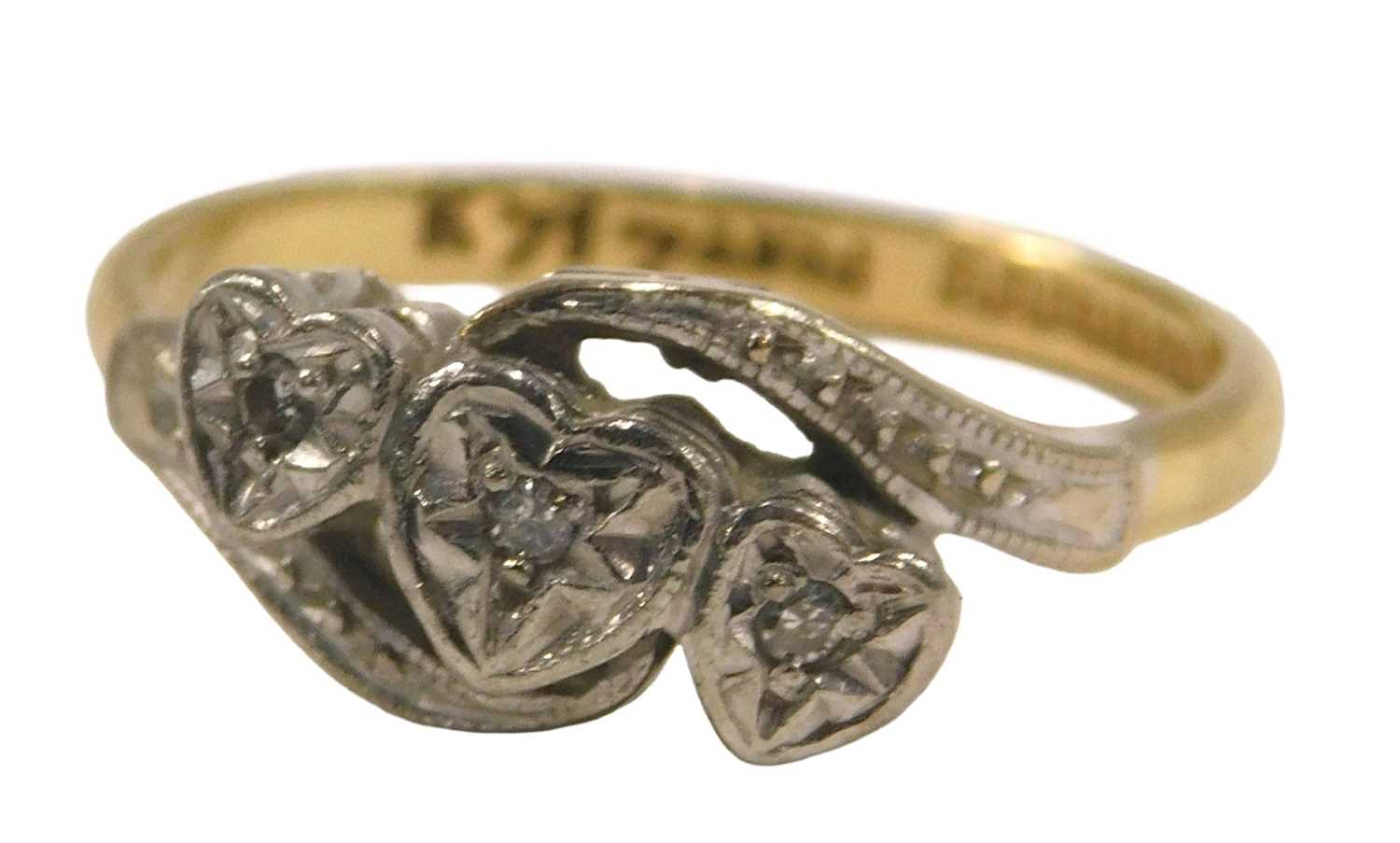 Lot 88 - A gold platinum and diamond three stone ring,...