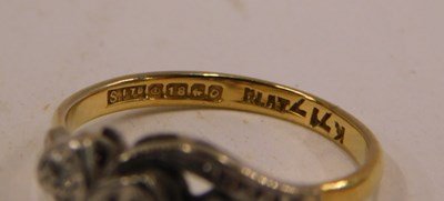 Lot 88 - A gold platinum and diamond three stone ring,...