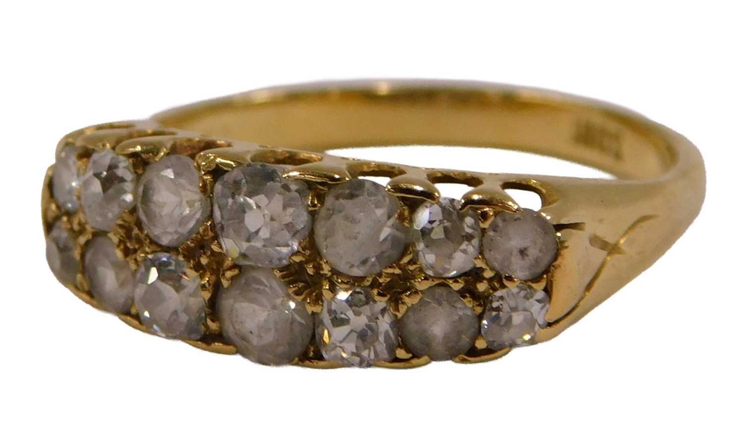 Lot 90 - A diamond and white stone fourteen stone ring,...