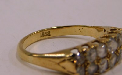 Lot 90 - A diamond and white stone fourteen stone ring,...