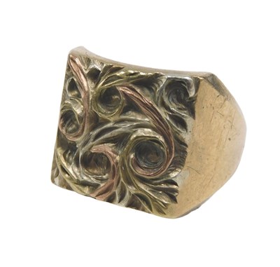 Lot 65 - A 9ct gold tricolour signet ring, the scroll...