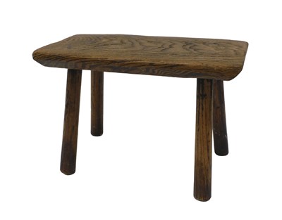 Lot 406 - A 19thC elm stool, the shaped rectangular top,...