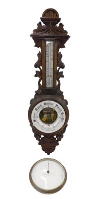 Lot 250 - A 19thC Black Forest style oak two dial wheel...