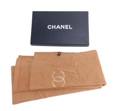 Lot 434 - A Coco Chanel logo woollen scarf, in tan, with...