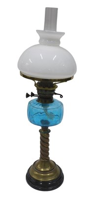 Lot 257 - A very late Victorian oil lamp, with clear...