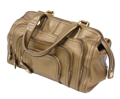 Lot 273 - A Givenchy bronze leather finish bag, in...