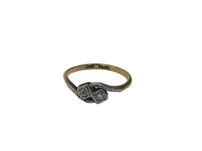 Lot 536 - An Art Deco diamond twist ring, set with two...