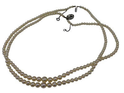 Lot 540 - A two row cultured pearl necklace, with...