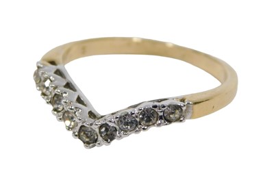 Lot 39 - A wishbone shaped dress ring, the white metal...