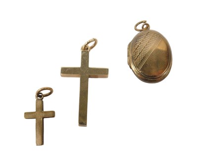 Lot 42 - Two 9ct gold crucifix pendants, 2.5cm and 1cm...