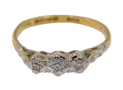 Lot 47 - An 18ct gold diamond three stone dress...