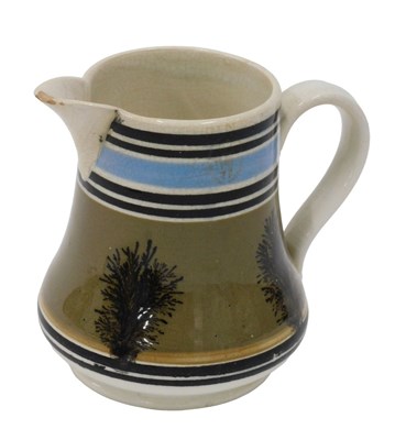 Lot 289 - A 19thC Mocha pottery jug, with strap handle,...