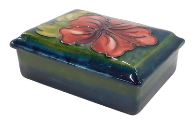 Lot 648 - A Moorcroft pottery Green Hibiscus pattern box...