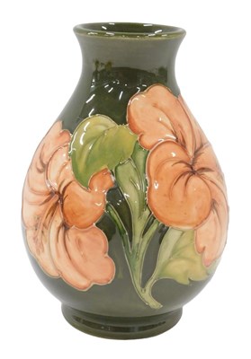 Lot 649 - A Moorcroft pottery Green Hibiscus pattern...