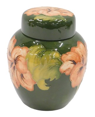 Lot 650 - A Moorcroft pottery Green Hibiscus pattern jar...