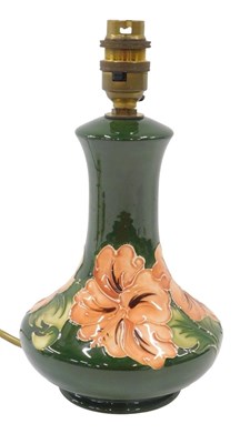 Lot 652 - A Moorcroft pottery Green Hibiscus pattern...