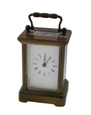 Lot 657 - An early 20thC miniature brass carriage clock,...