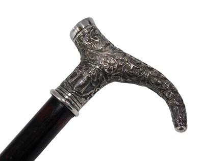 Lot 687 - An early 20thC ebonised walking cane, with...