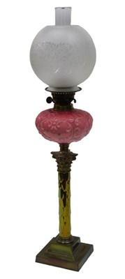 Lot 586 - A late Victorian oil lamp, with clear glass...