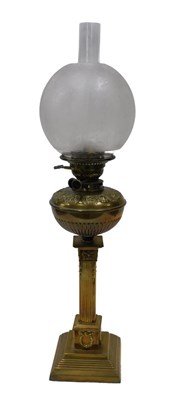 Lot 587 - An early 20thC brass oil lamp, with clear...