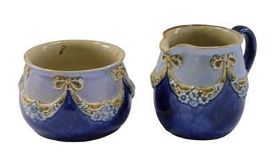 Lot 708 - An early 20thC Royal Doulton stoneware milk...