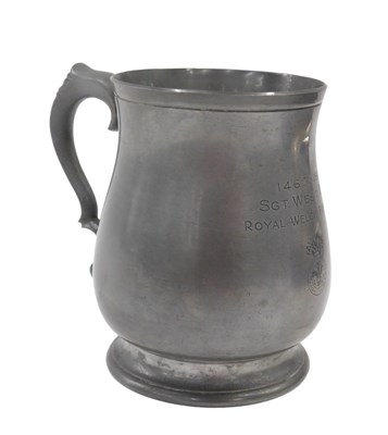 Lot 891 - A 20thC pewter tankard, of bulbous form with...