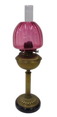 Lot 893 - An early 20thC brass oil lamp, with clear...