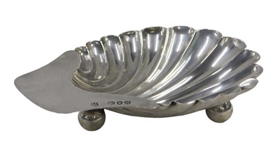 Lot 880 - A Victorian silver shell shaped butter...