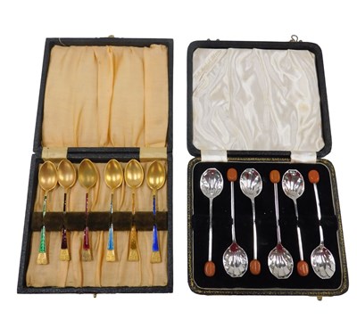 Lot 886 - A set of gilt metal and part enamel coffee...