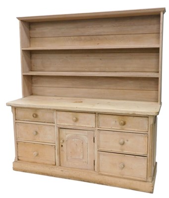 Lot 1008 - A 20thC pine dresser, the upper section with...
