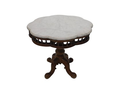 Lot 1022 - An early 20thC heavily carved walnut...