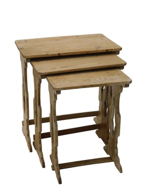 Lot 1024 - A 20thC nest of three pine tables, each with...