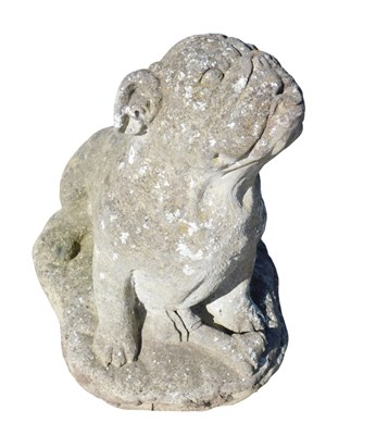 Lot 994 - A stone garden statue formed as a standing...