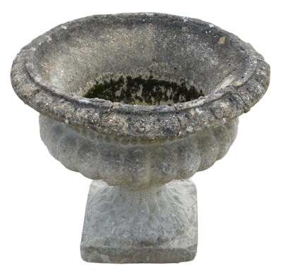 Lot 998 - A reconstituted stone garden urn, of classical...