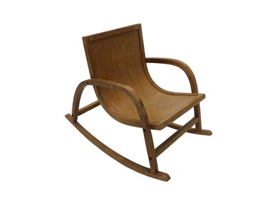 Lot 1045 - An unusual light oak rocking chair, with one...