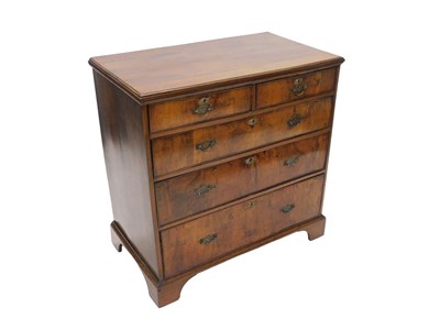 Lot 1048 - An oak and walnut chest, of two short and...