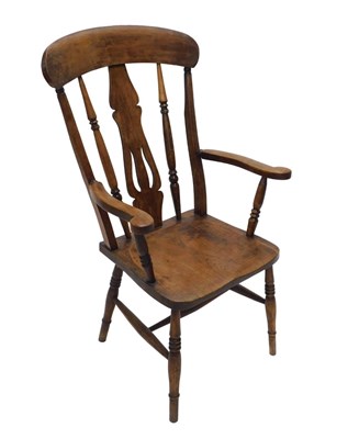 Lot 1056 - A 19thC comb back grandfather chair, with...