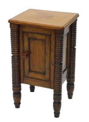 Lot 1069 - An unusual early 20thC oak pot cupboard, the...