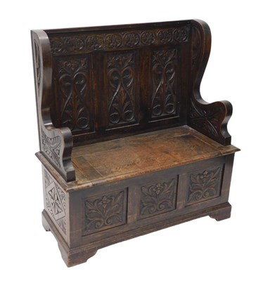 Lot 1088 - An early 20thC oak monk's bench, with heavily...