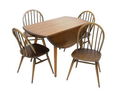 Lot 1098 - A mid 20thC dark Ercol drop leaf dining table...
